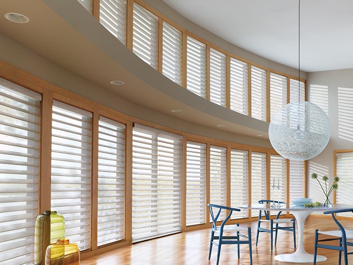 Dining room windows featuring Silhouette® Window Shadings; Fabric: Nouveau