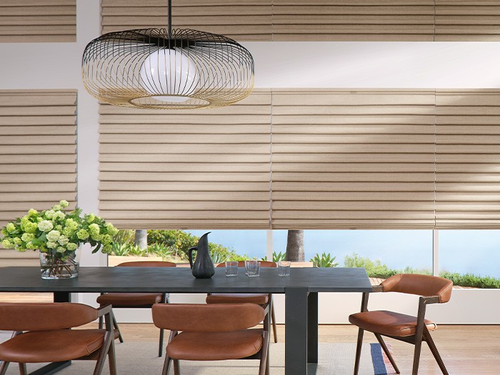 Dining room windows featuring Vignette® Modern Roman Shades; Fabric: Knox  Color: Simply Pewter