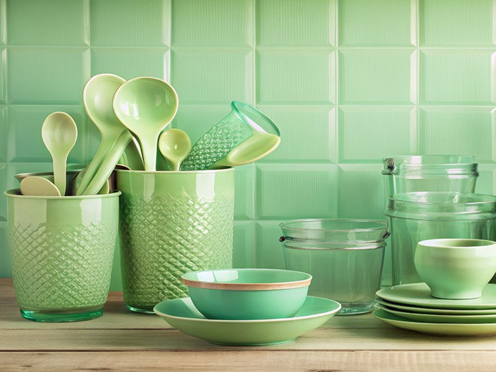  Bright green kitchen utensils, plates, bowls, and jars.
